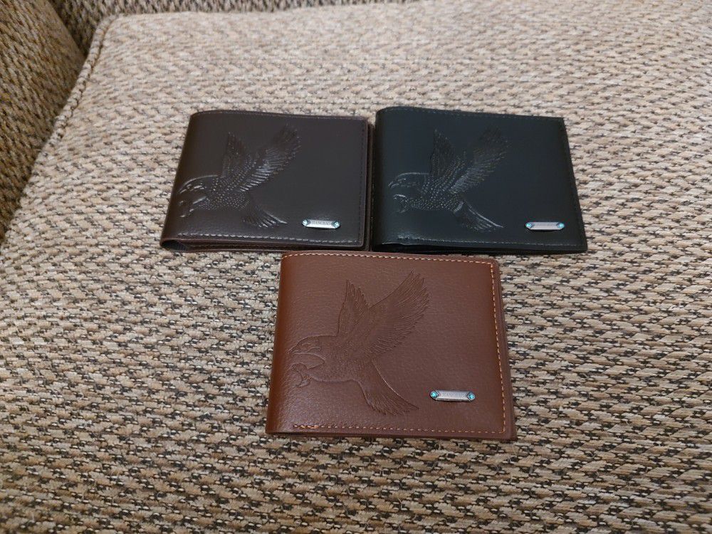 EAGLES LEATHER  WALLETS.  BLACK, BROWN AND DARK BROWN.  $12 EACH.  NEW. PICKUP ONLY 