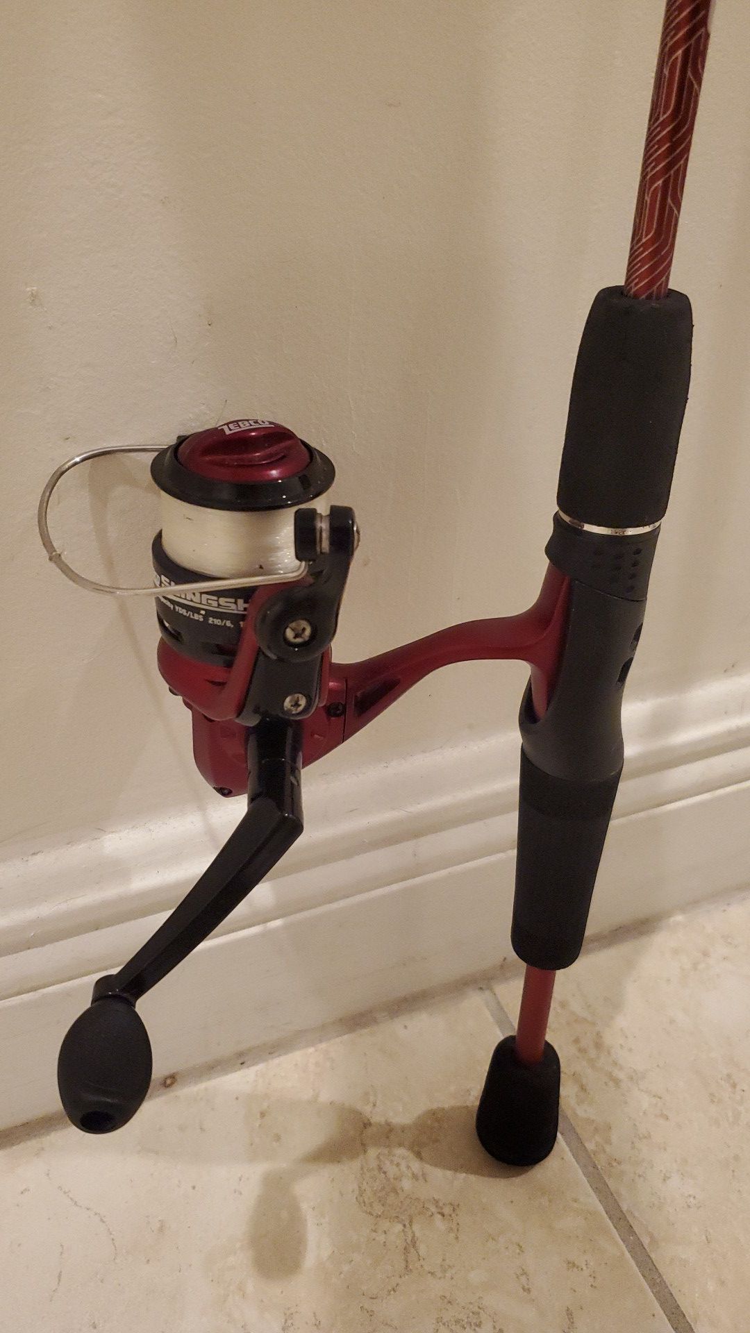 Zebco Slingshot fishing rod pole and reel with a tackle box