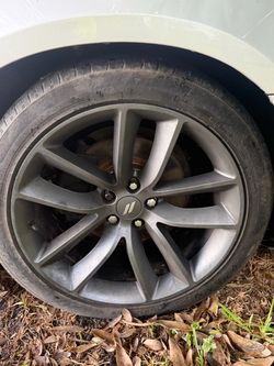 Set of 4 OEM Dodge Charger 20” rims with tires.