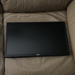 2 Dell Monitors With Four Keyboards In Two Stands