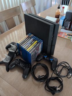 PS4 with Games, 3 Controllers and 2 Controller Charger