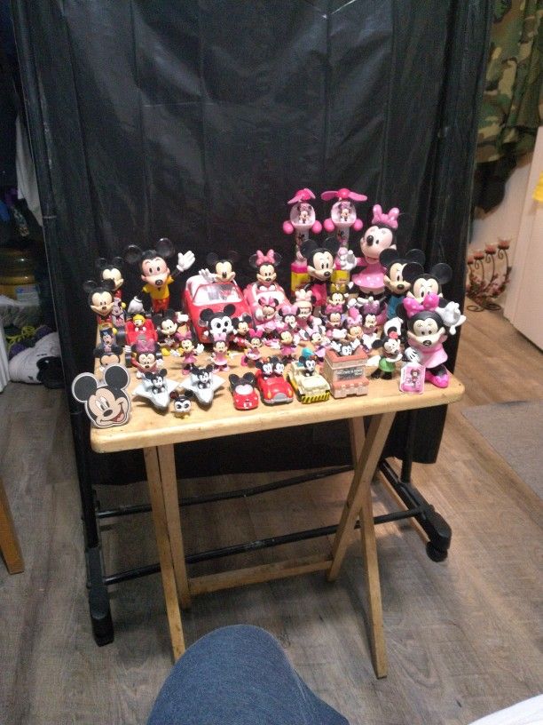 A Large Collection Of Mickey Mouse And Minnie Mouse Figurines And Toys.