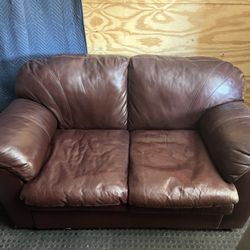 Free 2 seat leather loveseat no cracks just wrinkles still kind of plush