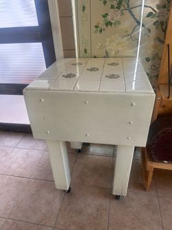 Great vintage butcher block with wheels and tiled top