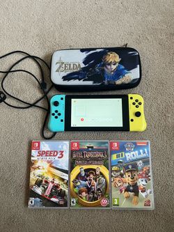 Nintendo Switch V2 console with 3 games and Zelda case