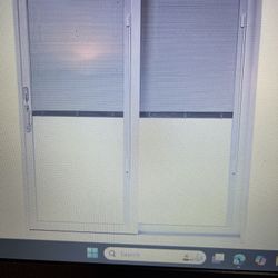 brand new - Anderson glass sliding door, 72”W x 82 1/2”T , with Build in Blinds