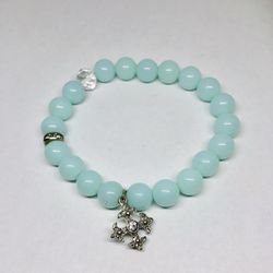 Trendy bracelet with acrylic beads and Maltese cross in silver tone and rhinestone