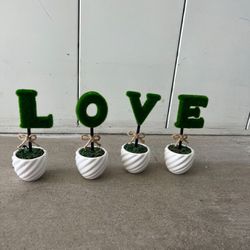 LOVE Small Flower Decorations With White Vase Spelled Out  L-O-V-E