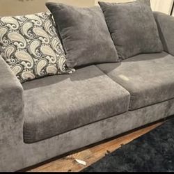 Love seat couch with pillows