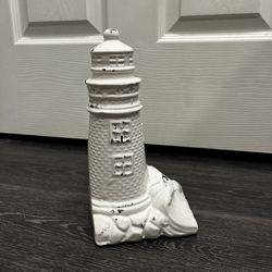 decorative lighthouse figurine, 9.5” tall