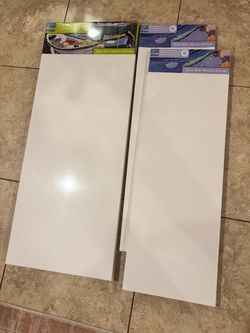 3 canvases, plastic wrapped