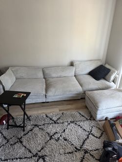 couches// entertainment center with fire place.