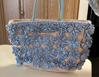 Woven tote with raffia flowers
