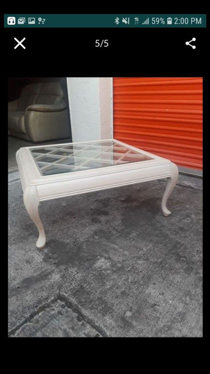 Two glass end tables
