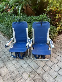 Set of two portable backpack beach chairs, which feature a multi-position reclining design