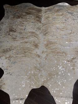 Custom Designed Cowhide Rug With Silver Paint Design
