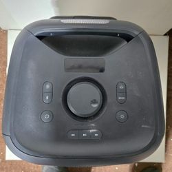 Onn portable boombox lit up with colors and Bluetooth.