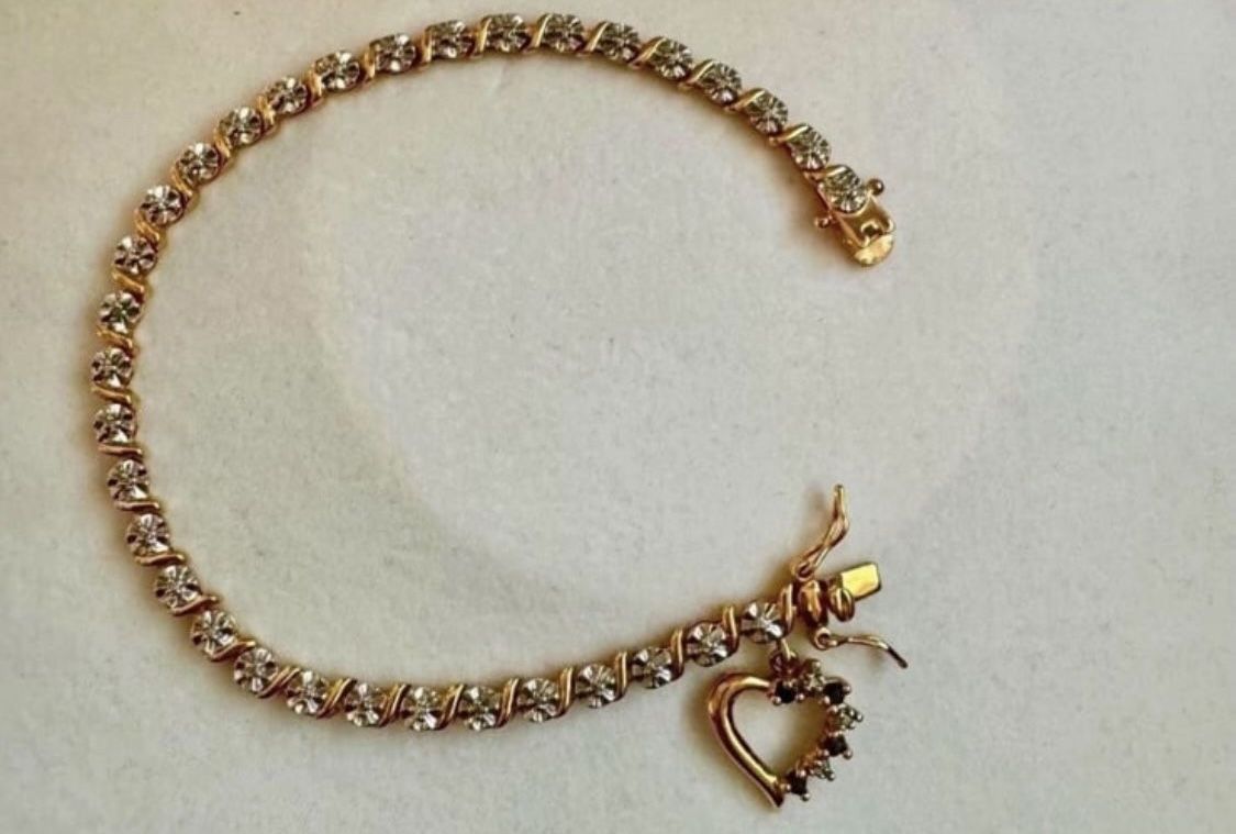 Vintage 925 sterling silver gold cubic zirconia tennis rhinestone bracelet with heart shaped charm  Approx 7.75” length  In great condition
