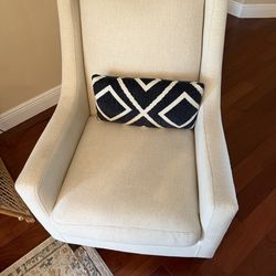Cream Cloth living room chair with accent pillow. Barely used.  Looks good.