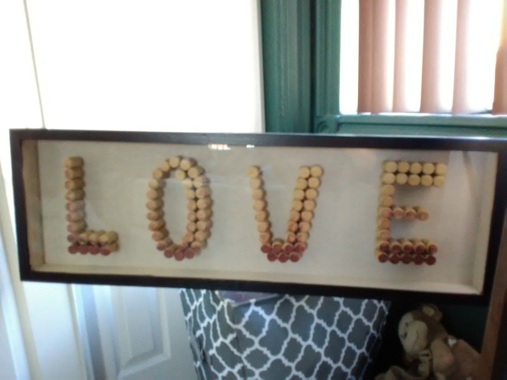 Love wall decoration made of wine tops