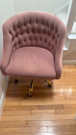 Upholstered pink desk chair. Gold hardware