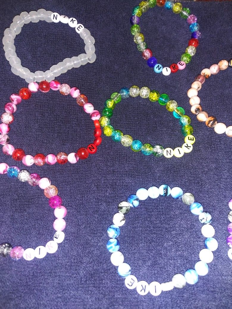 Nike. Pink. Bracelets