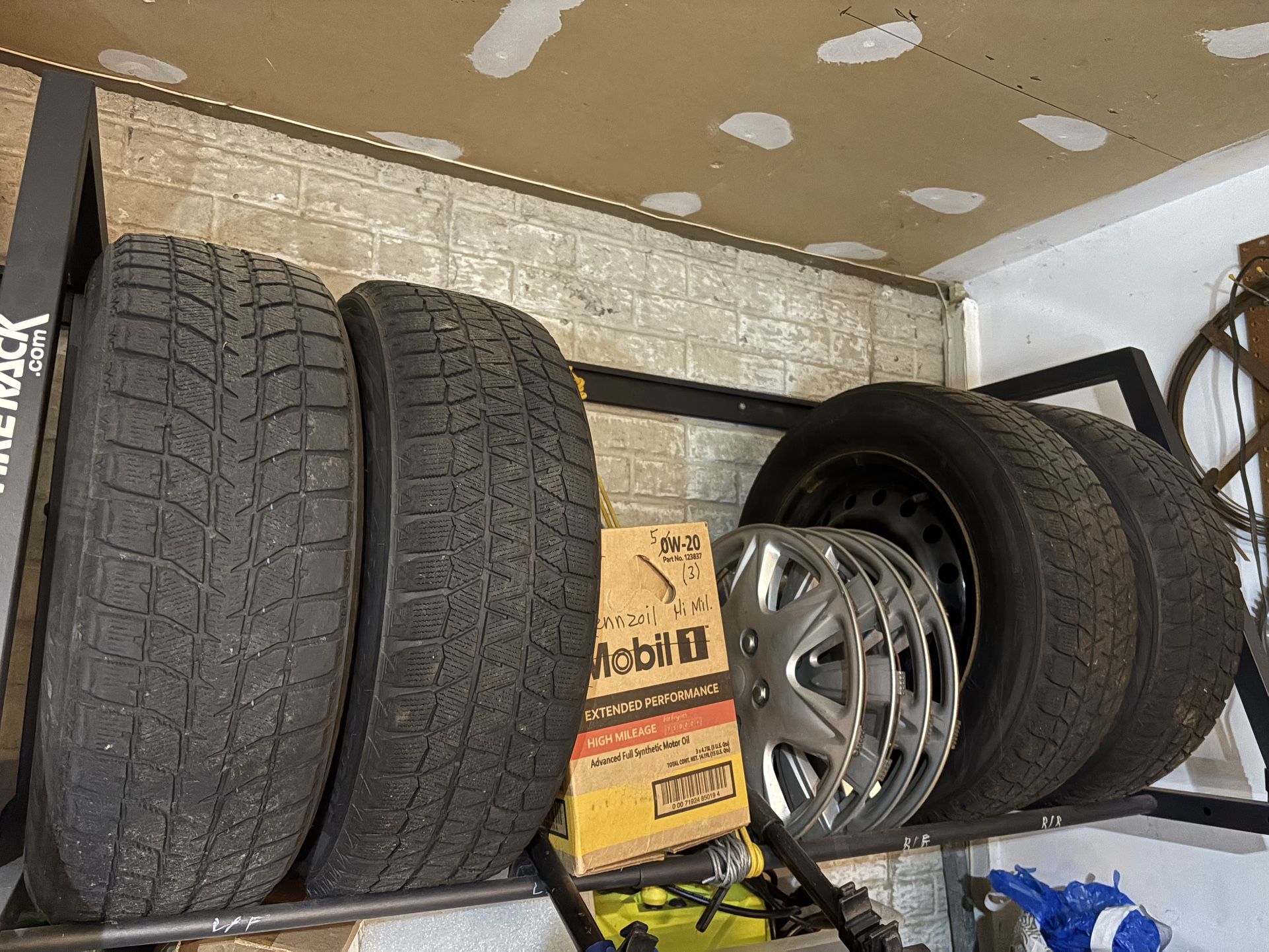 4 x 15” Bridgestone Blizzak snow tires, rims and hub caps