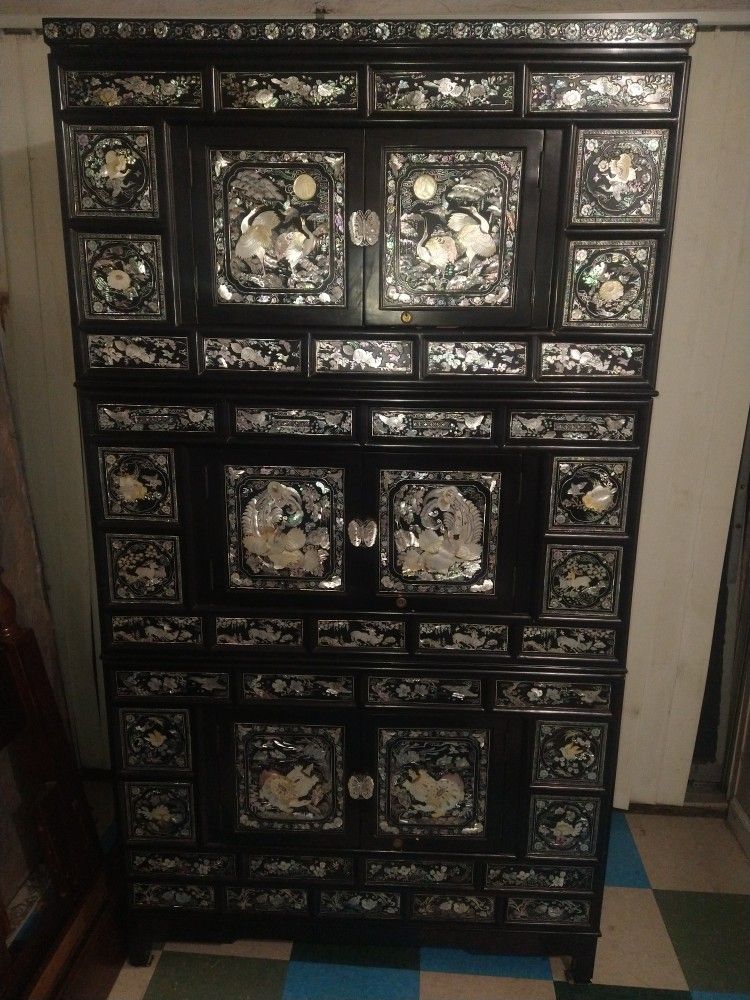 $450 or best offer. Mother Of Pearl Oriental Theme Black Lacquer Cabinet. 3 Lightweight Stackable Sections has Lock And Key.  42 W. 76.5 T. 20 Deep Ca