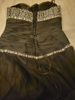 Black prom dress with a beaded or sequined sweetheart bodice