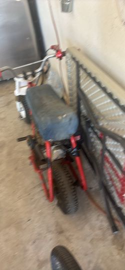 Red minibike needs chain to be put on and brake needs to be re-welded
