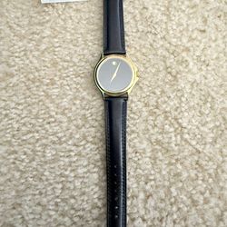 beautiful Unisex Movado watch with original box and accessories. New battery installed (7/3/25).