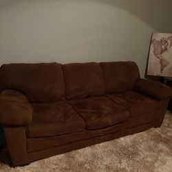 Brown sofa and loveseat