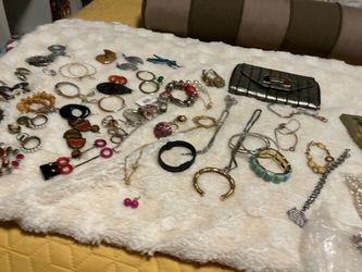 A lot of costume jewelries from different place like Dubai, rings, bracelets, a lot of earrings, long chains and more