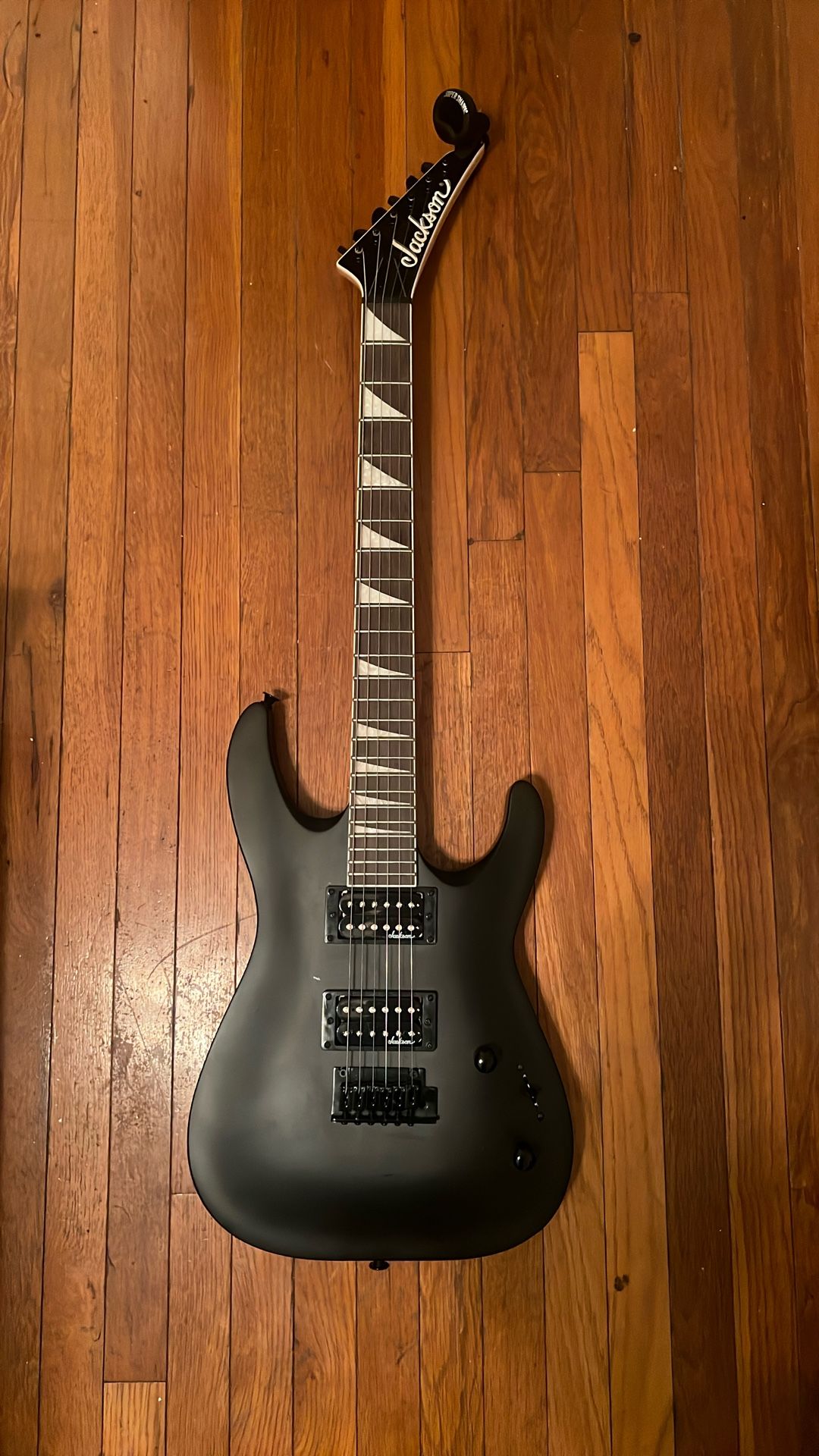 Black Jackson Guitar With Line 6 Amp