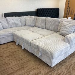New Gray Sectional With  Storage Chaise And Pull Out Sofa 