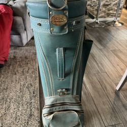 Toney Penna golf clubs with golf bag