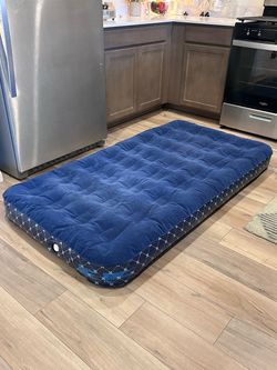 38x71x6h inches Velvet Top Navy Blue Air Mattress. Has a leak at the white outlet.