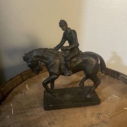 Cast bronze jockey on horse statue
