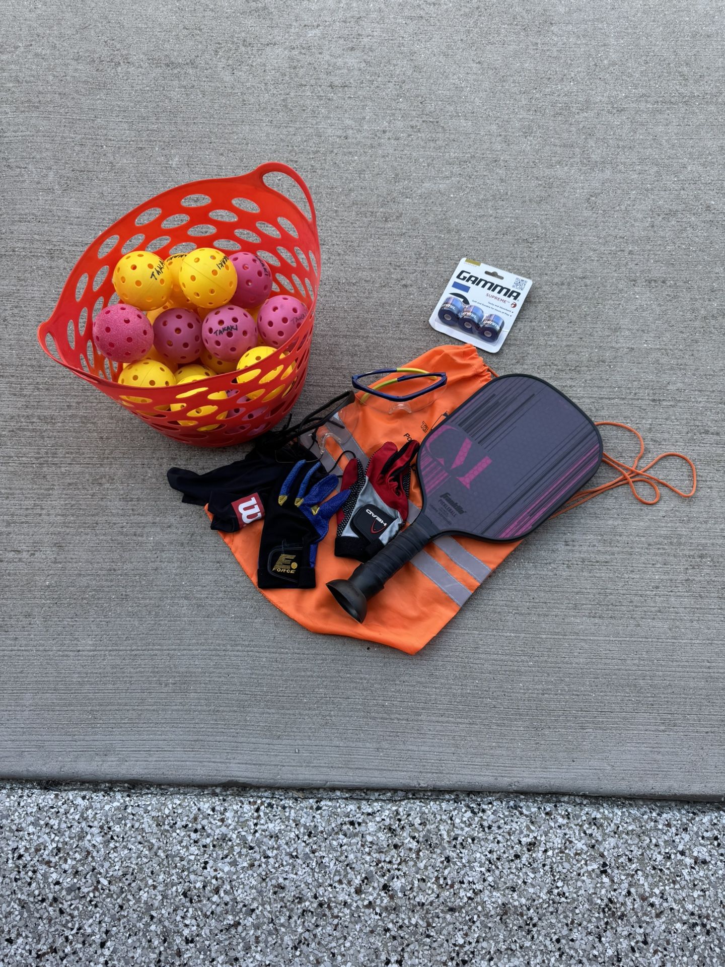 Pickleball paddle,  balls, safety goggles and right hand gloves