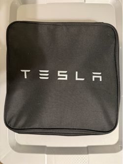 Tesla home charger and charging adapter