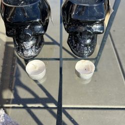 Two Glass Black Skull Candle Holders With Candles