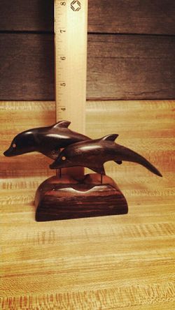 Ironwood dolphin carving statue