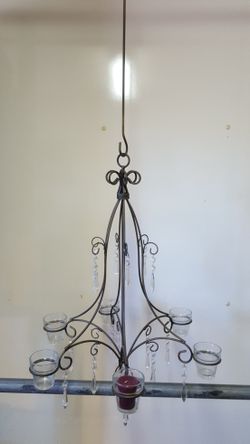 Unique vintage rod iron candle chandelier can hold 6 candles. Like new been in storage sold for over 100. Only asking 30