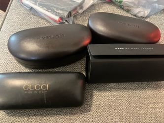 Four really nice glass cases, Gucci, Michael Kors, and Mark Jacobs