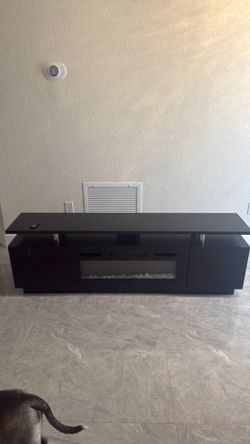 Used tv stand with electric simulator fire pit
