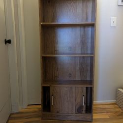2 Bookshelves with sliding doors on bottom shelf 