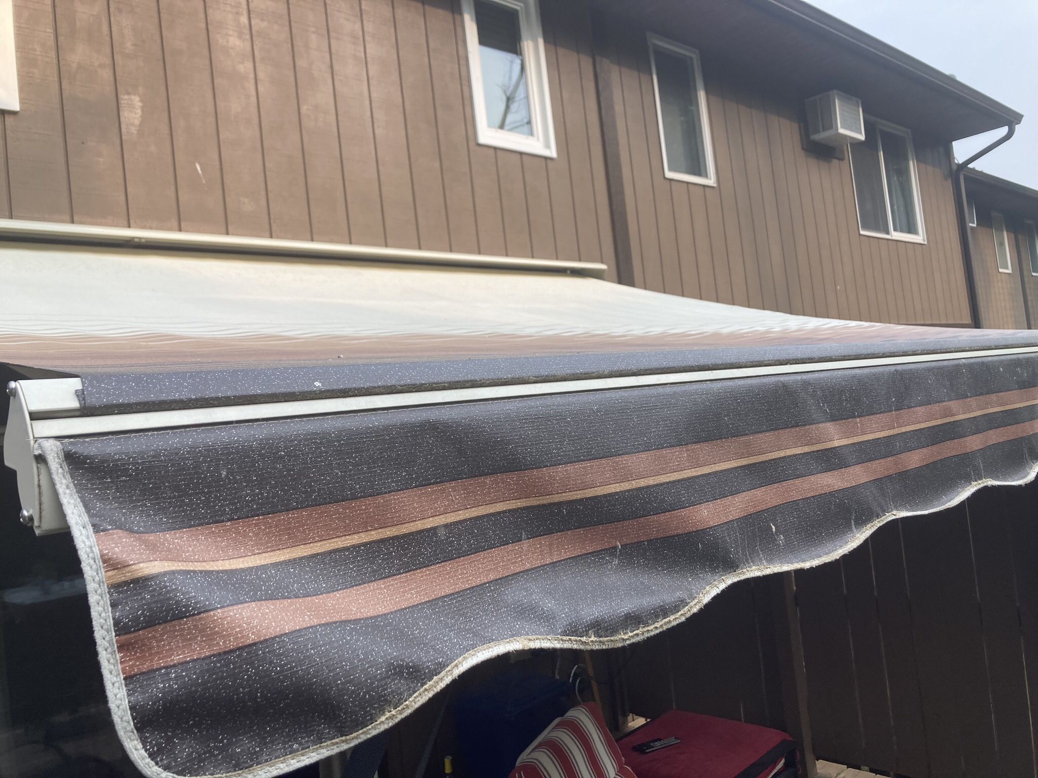 Sun Setter Motorized Awning Wall Mounted 12ft By 10ft 2in Coffee and Cream Stripe In Color With Weather Hood