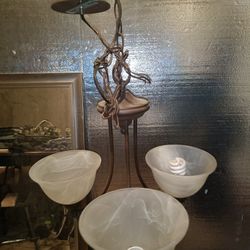 antique vintage brass chandelier with alabaster glass shades.