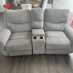 Couch And Double Recliner With Area Rug