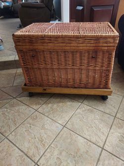 Large wicker basket on casters